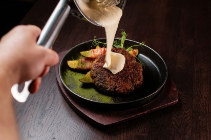 Ham steak with bacon potatoes and cheddar cheese